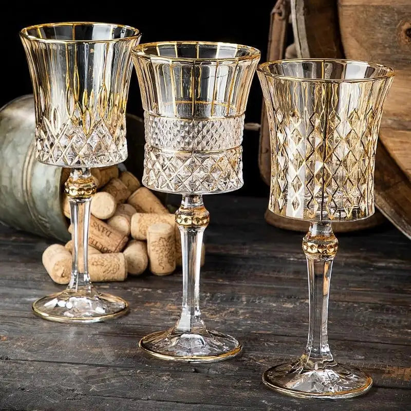 Gold and clear glass goblet with diamond pattern, elegant design.